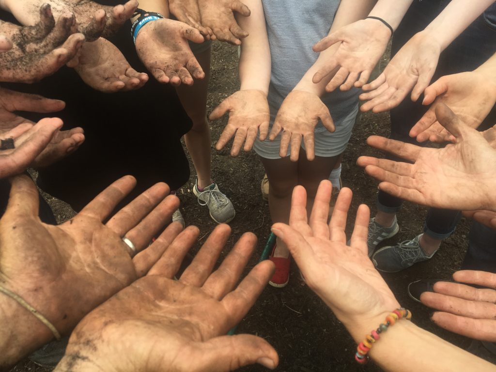 volunteer hands waring